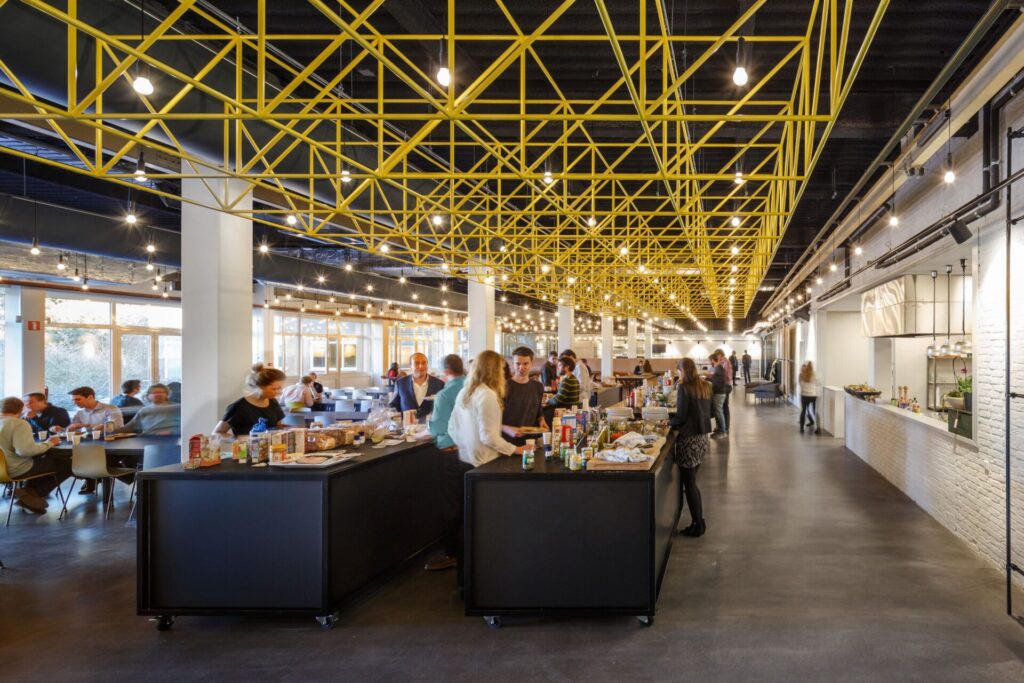 The yellow chandelier at centre stage in the Ampelmann office is inspired by the motion-compensated gangways they design and engineer for easy offshore access.