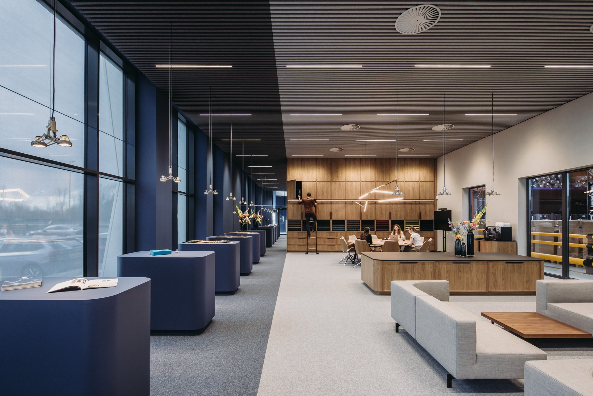 Exterior view of VEBE's new facility showcasing its transparent design