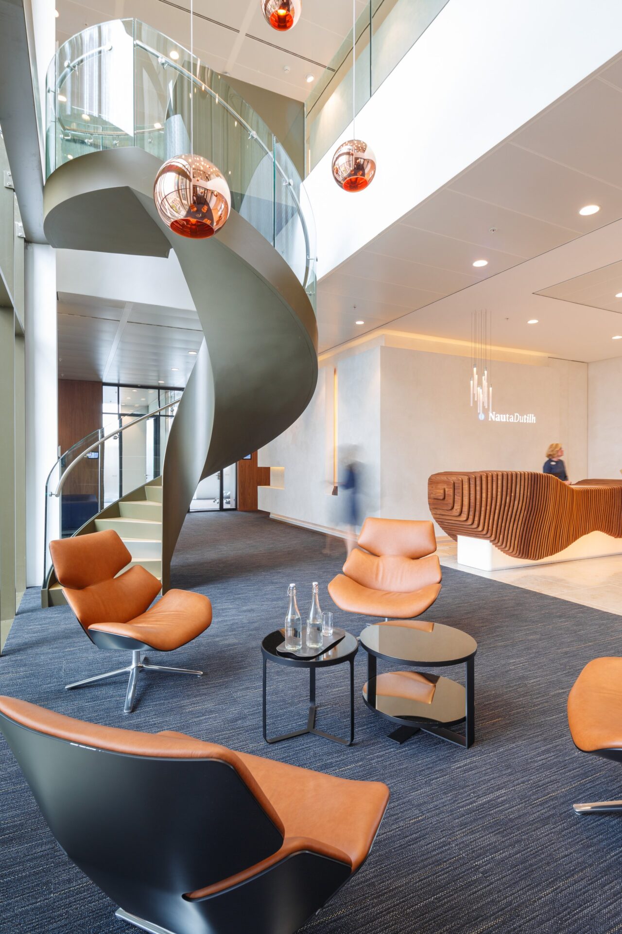 Interior design with walnut lamella in NautaDutilh penthouse.