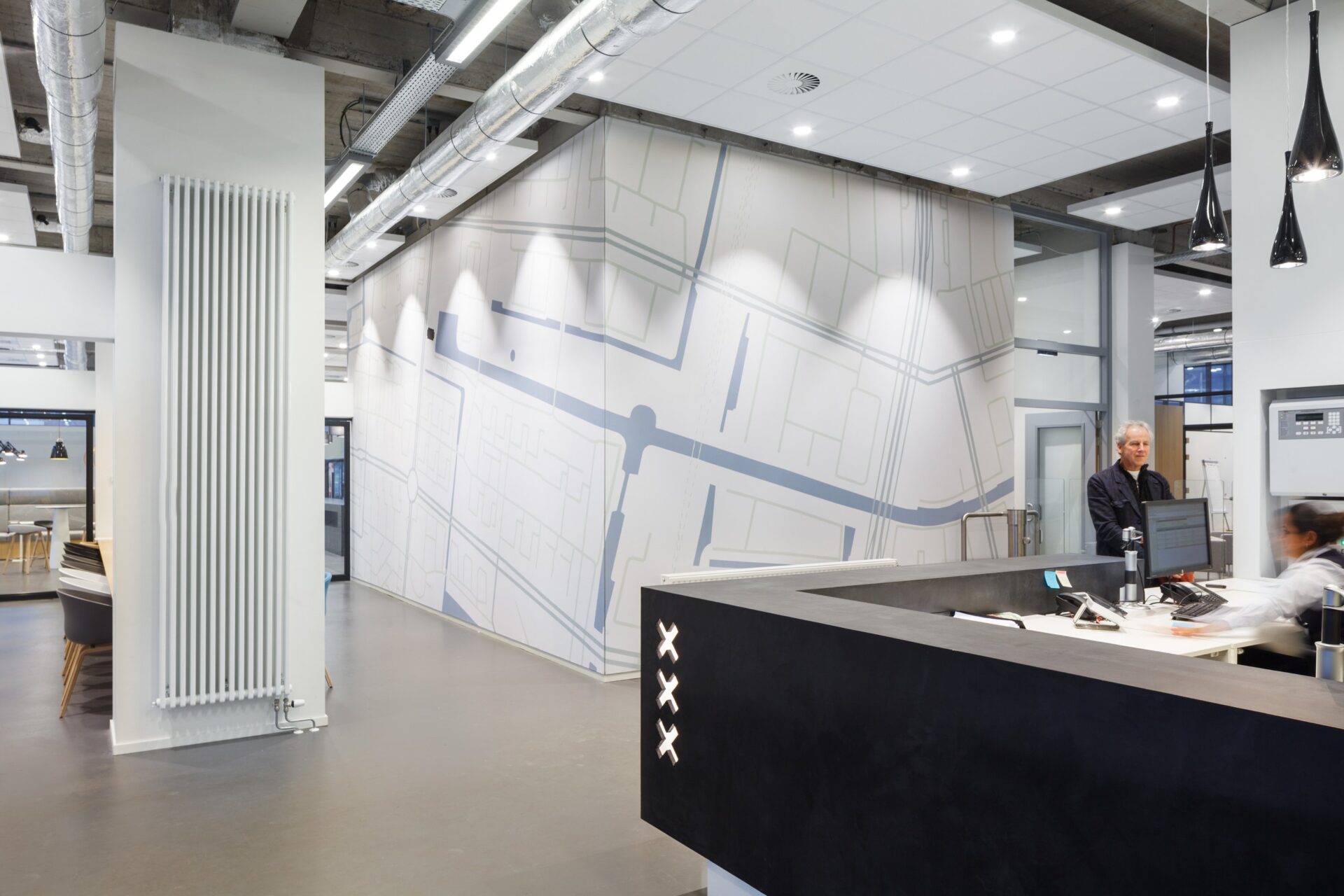 The rigid post-war building is completely opened up, leaving installations in sight