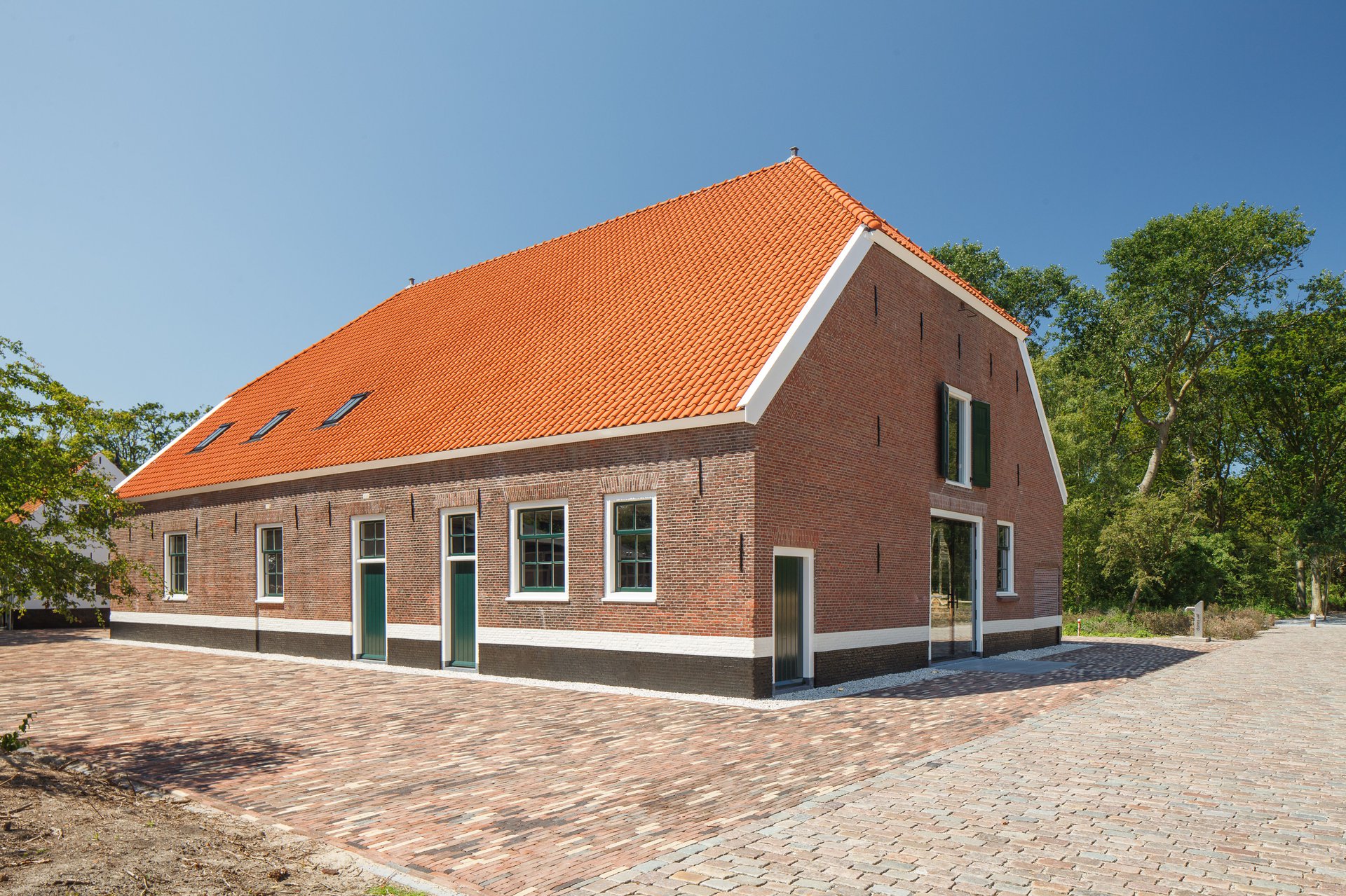 Historic barn in decay converts to visitor center as part of the transformation of a farm ensemble