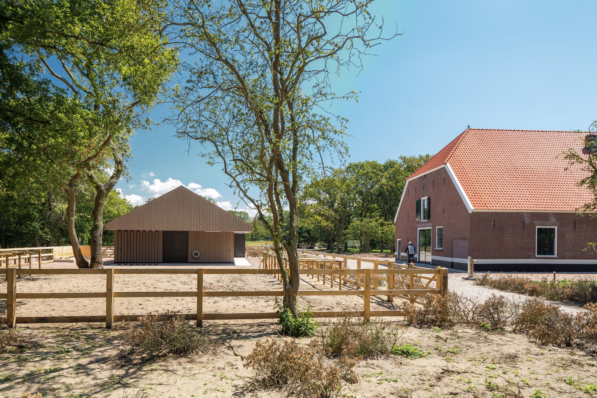 Historic barn in decay converts to visitor center as part of the transformation of a farm ensemble