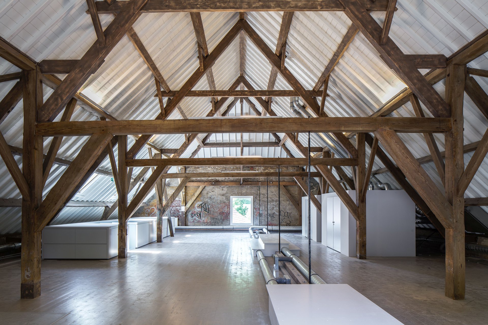 Historic barn in decay converts to visitor center as part of the transformation of a farm ensemble