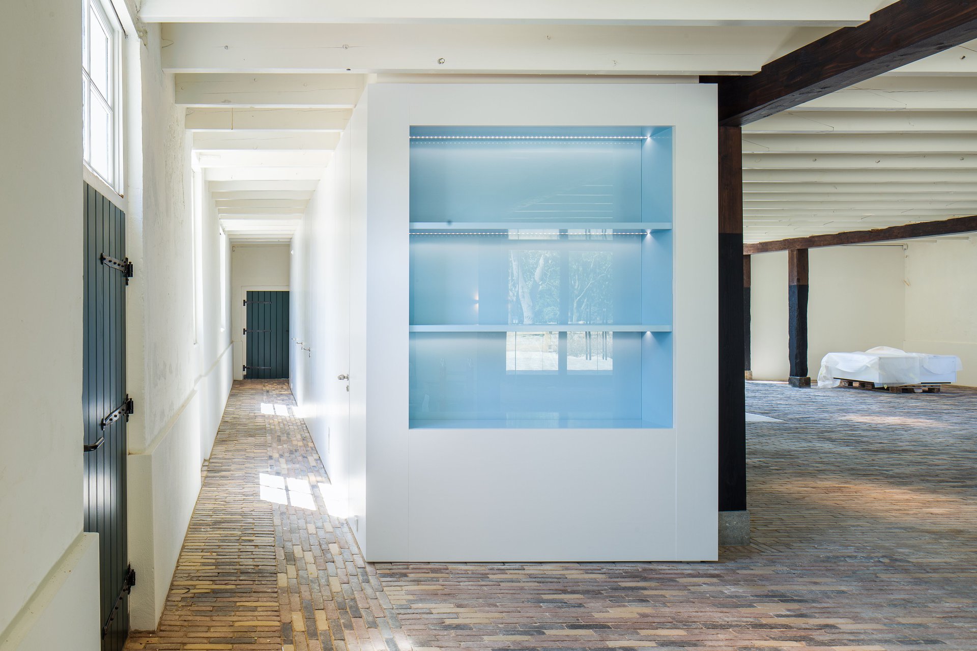 Historic barn in decay converts to visitor center as part of the transformation of a farm ensemble