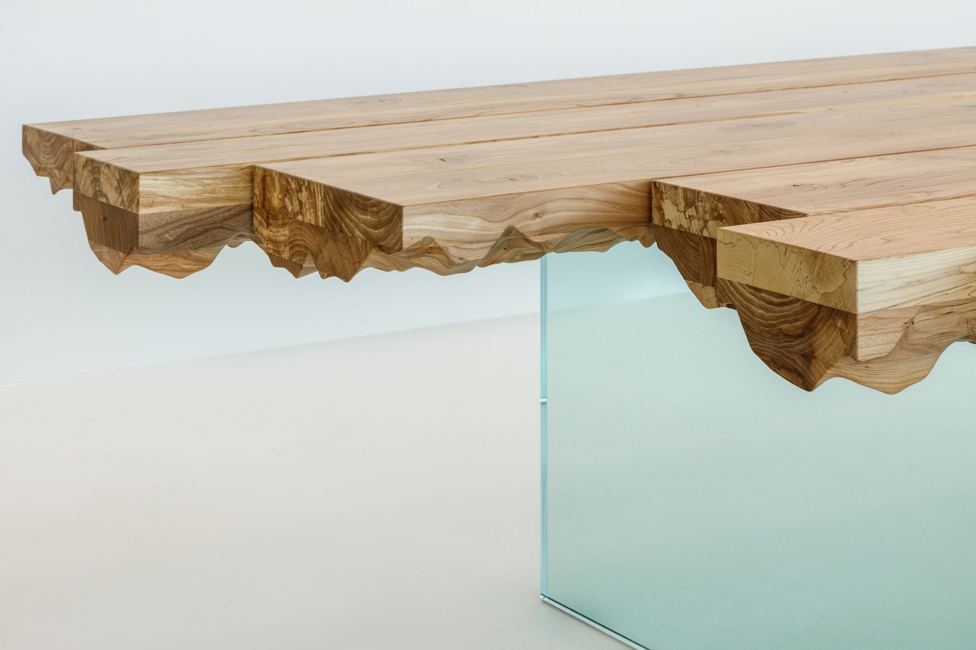 Minimalistic pieces of custom furniture stand out against a gallery inspired interior