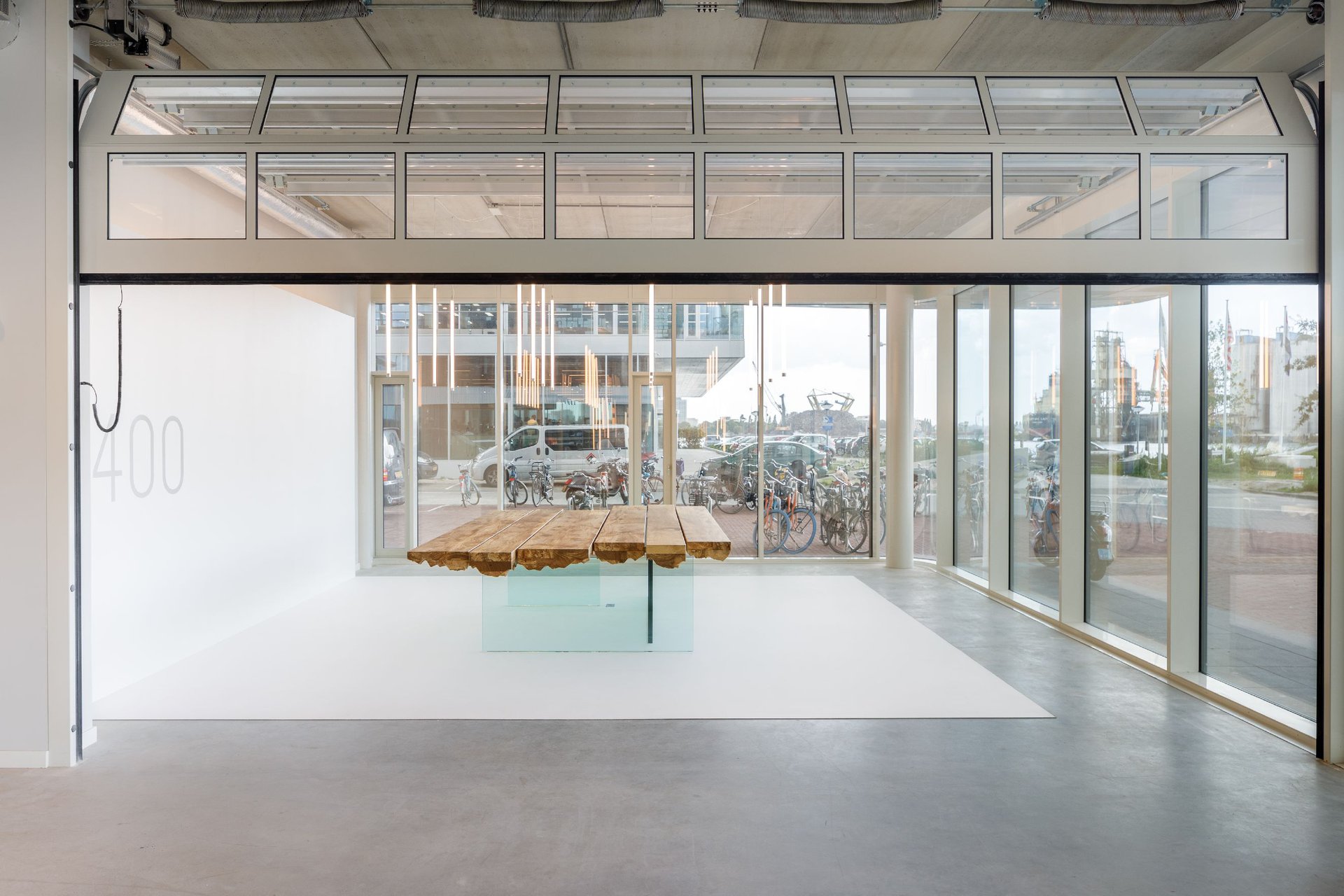 Minimalistic pieces of custom furniture stand out against a gallery inspired interior