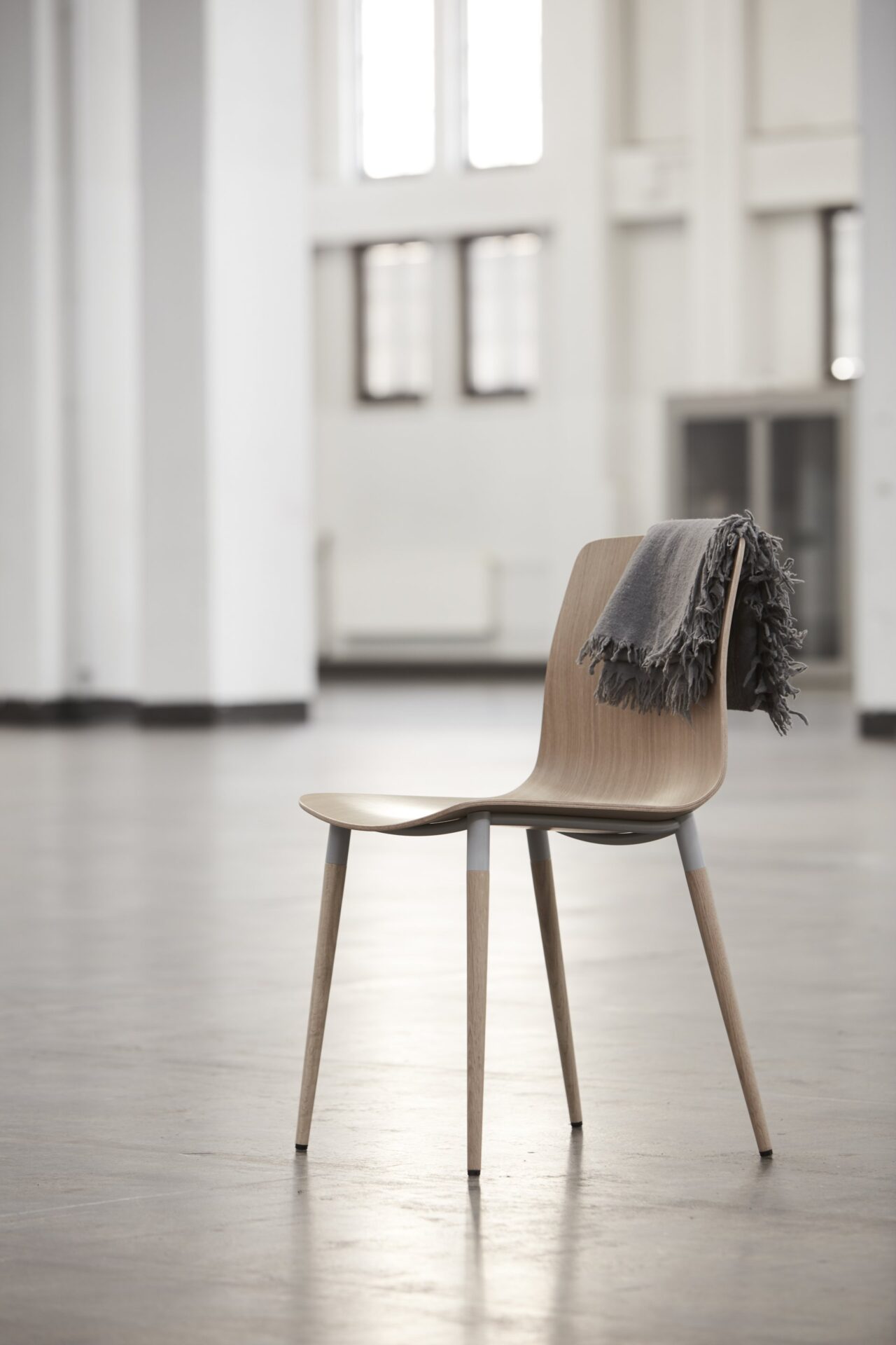 A chair from the Pi Collection in a modern setting