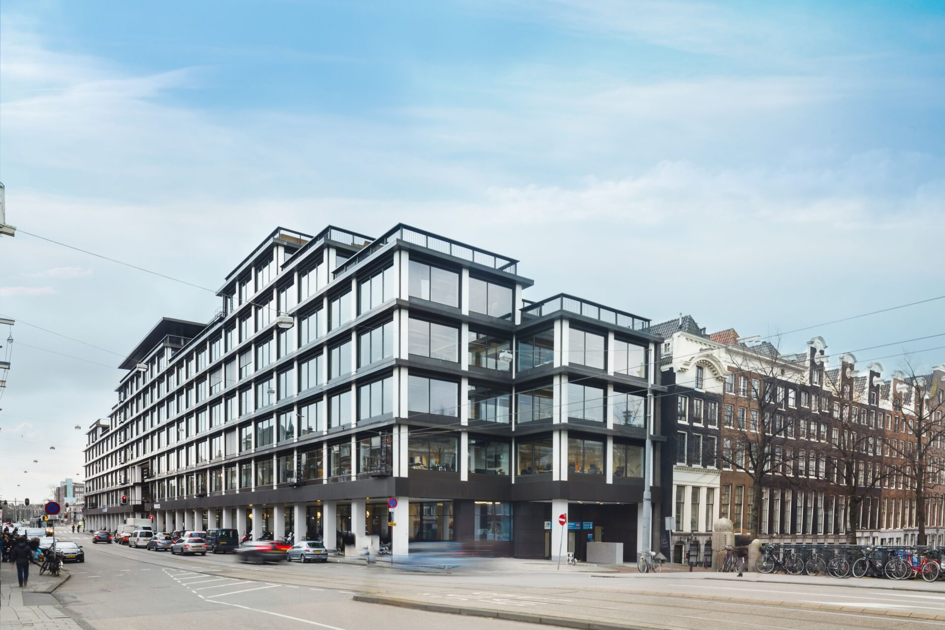 Office space with glass walls and natural light.