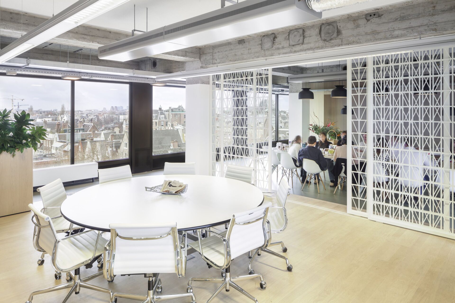 Interior view of the office with modern furniture and lighting.