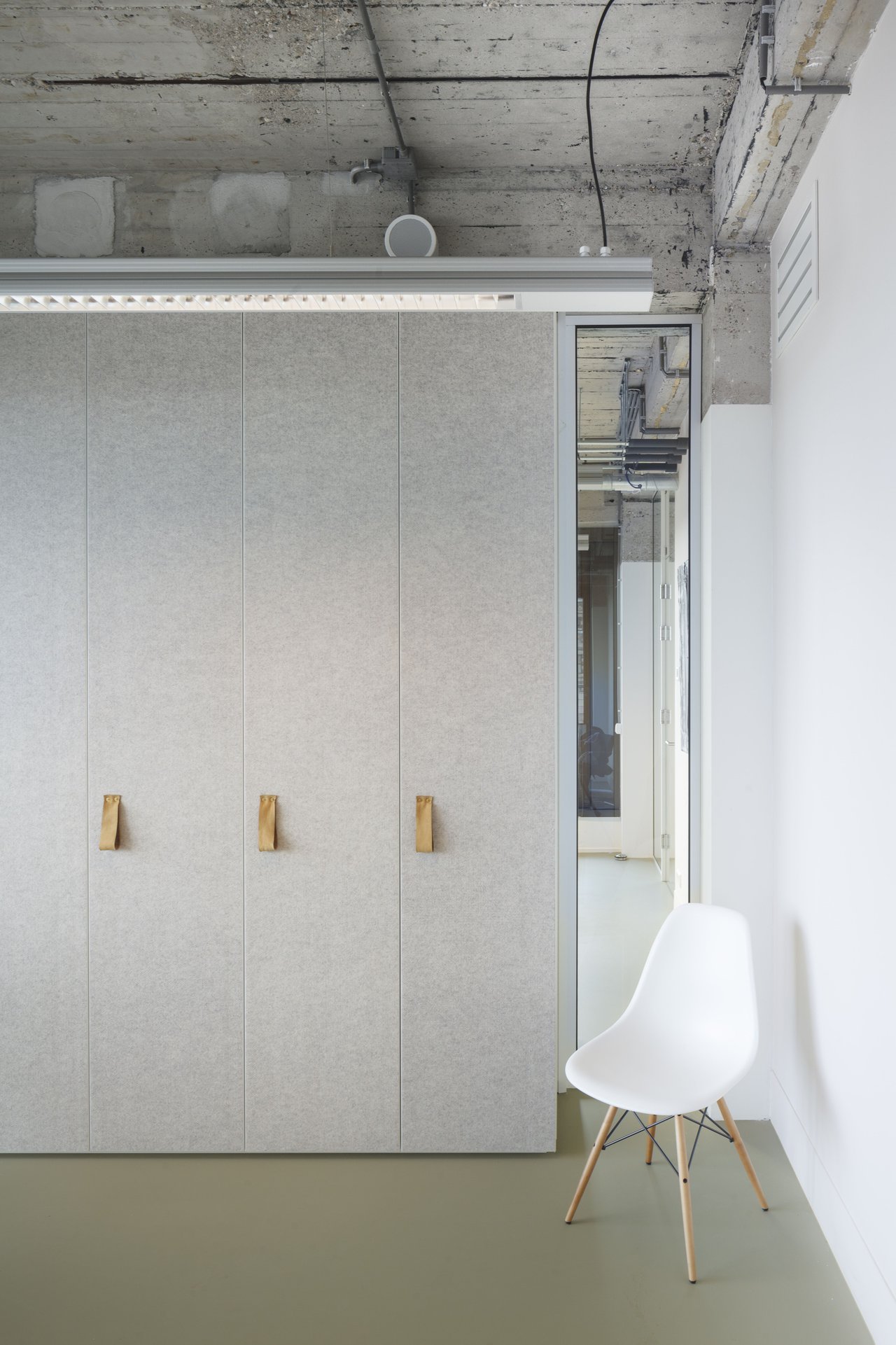 Office interior with natural light and modern design.