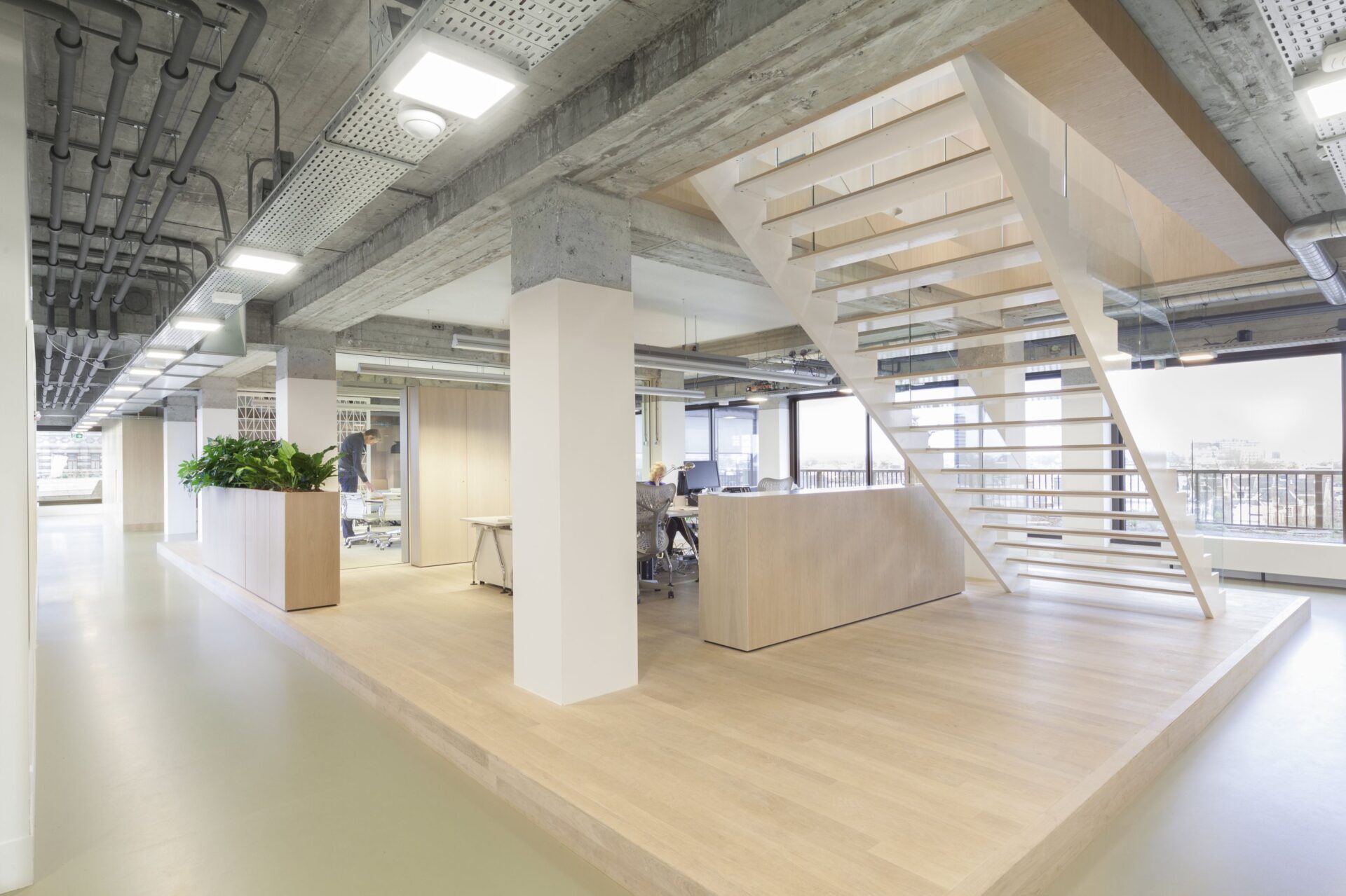 Meeting area with modern furniture and lighting.