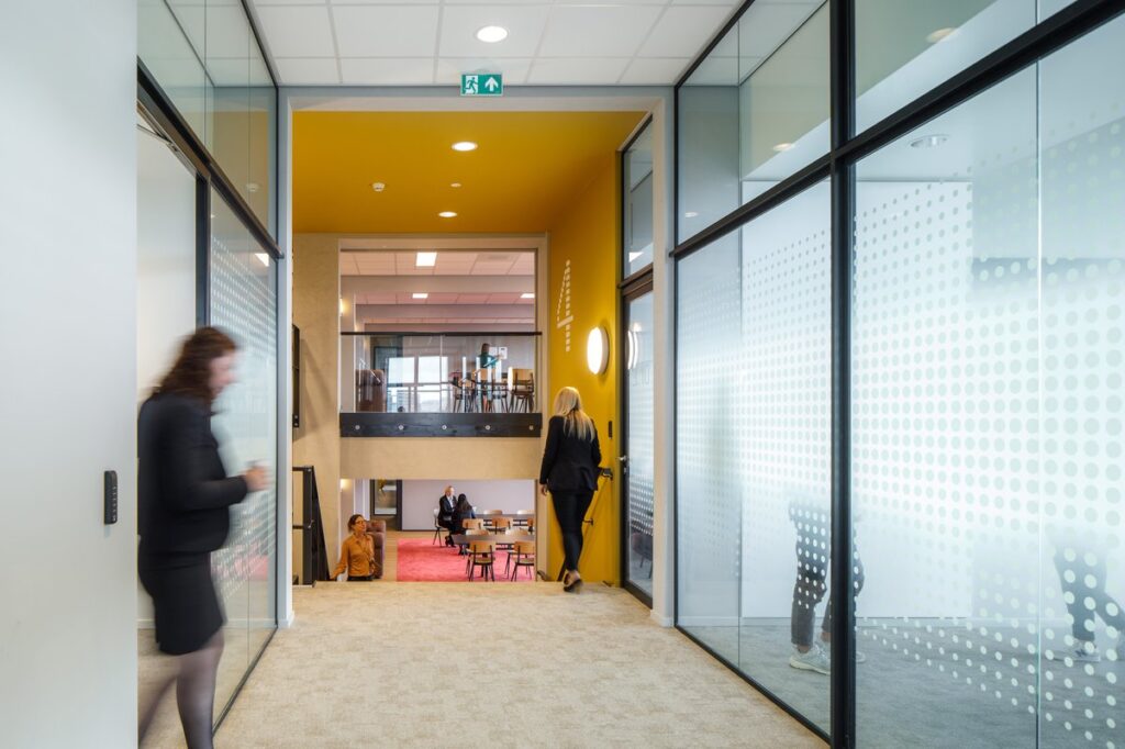 High-rise voids connecting education and office wings.